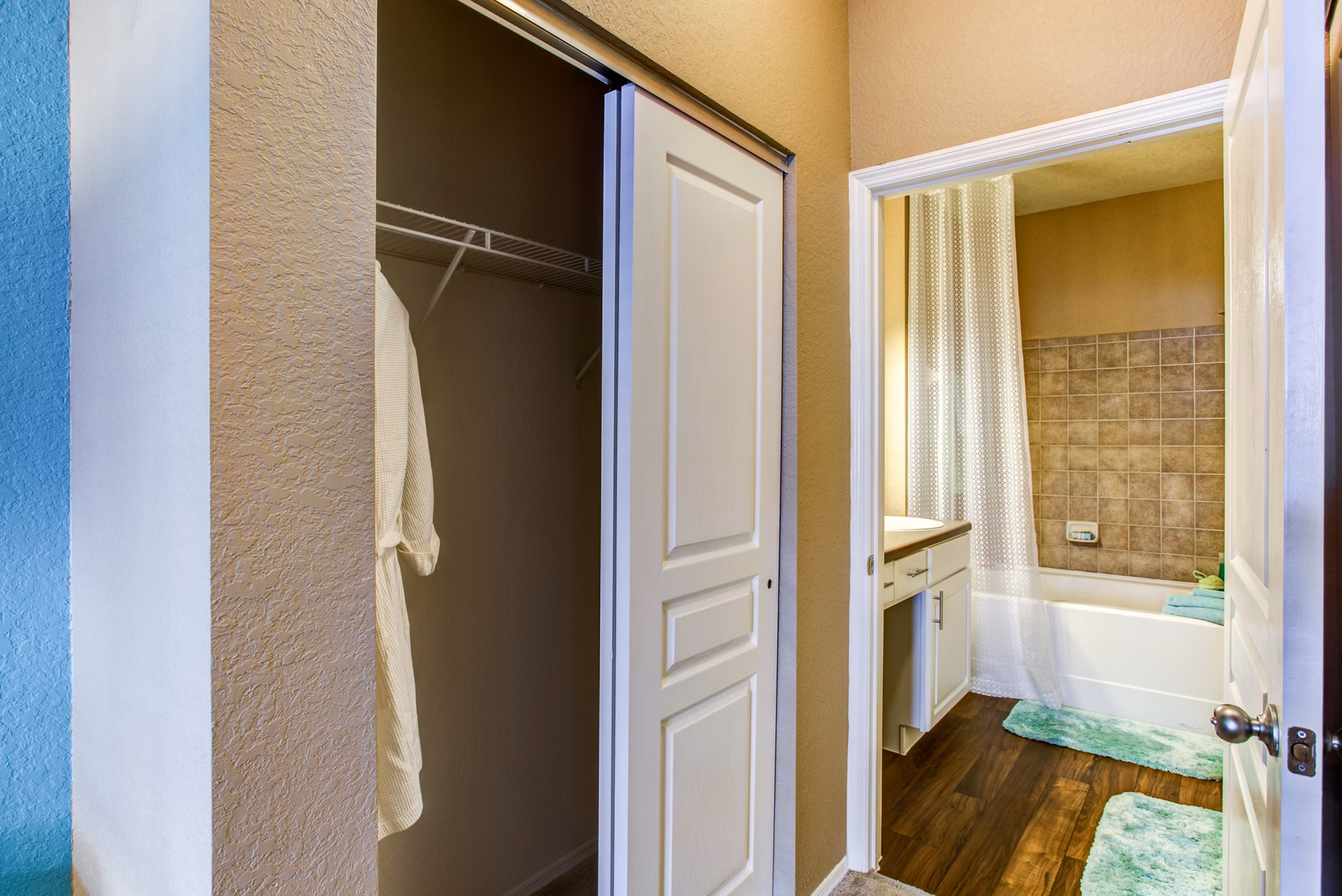Bathroom featuring modern fixtures and marble countertops at Villas at Gateway Apartments
