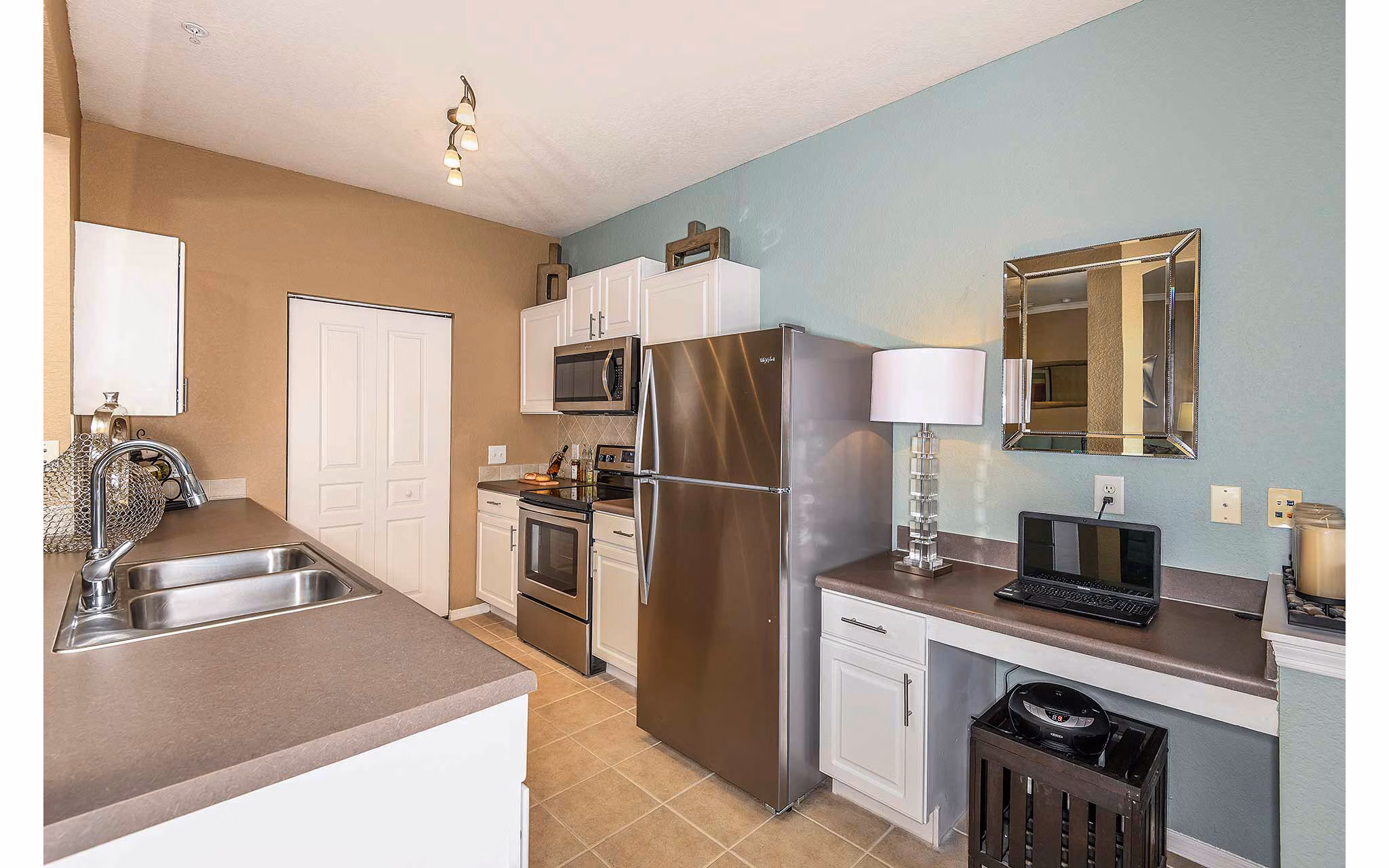 Modern kitchen featuring stainless steel appliances at Villas at Gateway Apartments