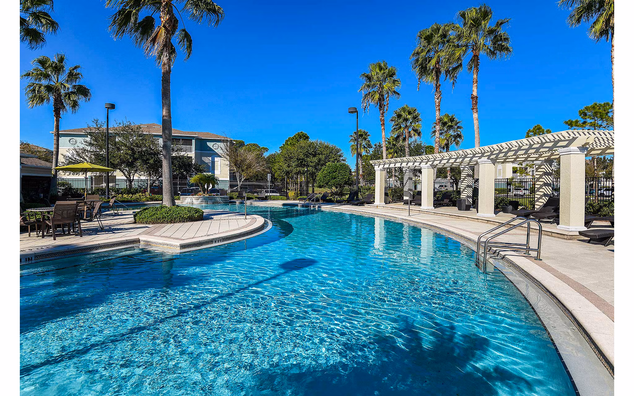 Refreshing pool area at Villas at Gateway Apartments offering luxury and relaxation for residents