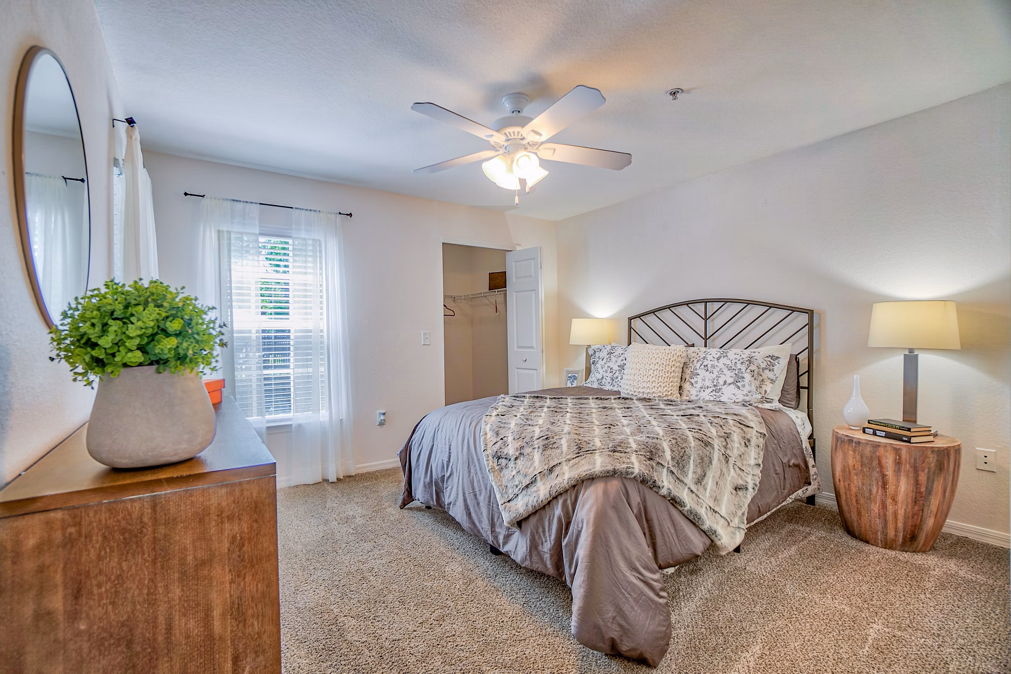 Cozy bedroom with modern decor at Elmhurst Village Apartments