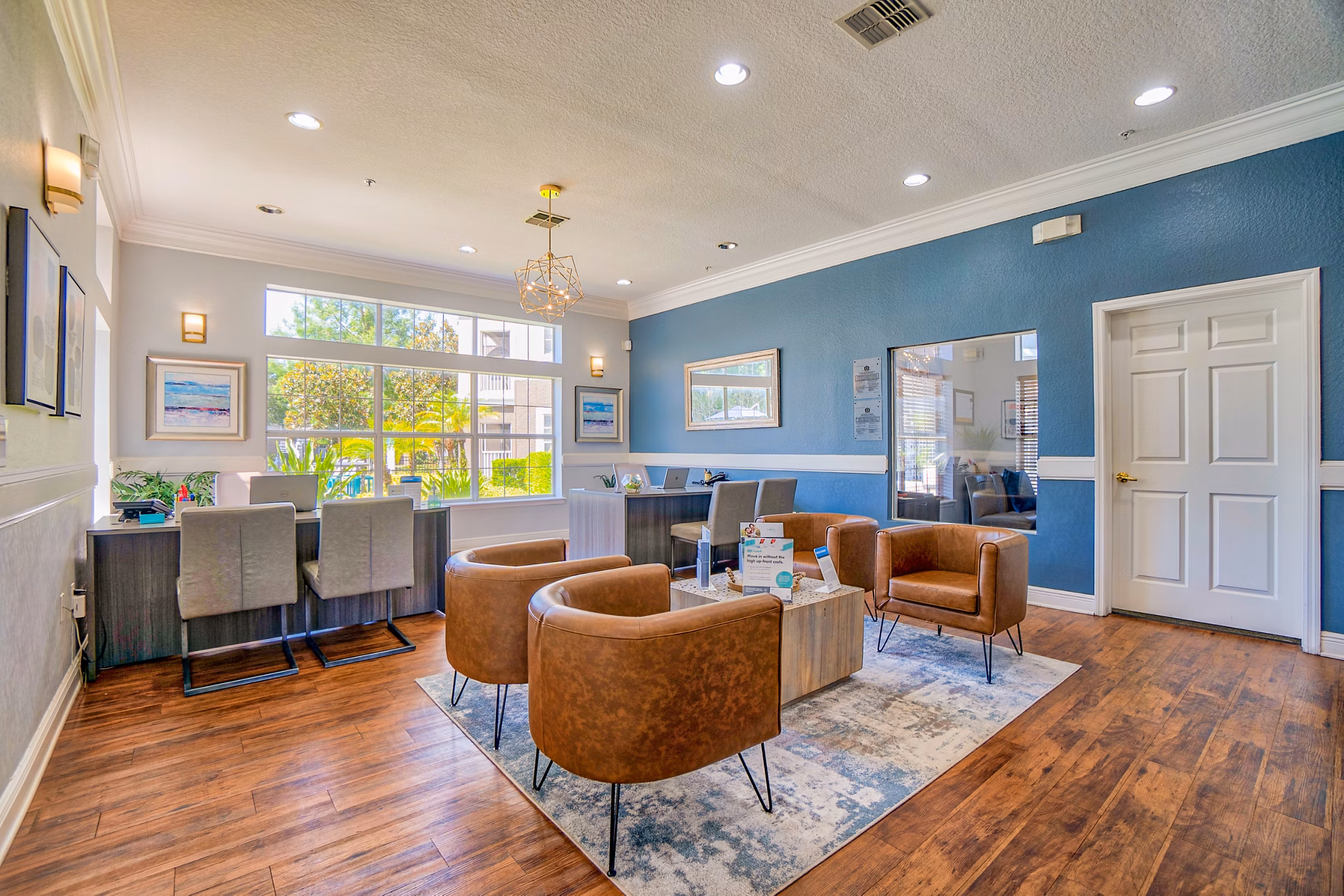 Clubhouse with modern furnishings at Elmhurst Village Apartments, a luxury property by Greystar in an upscale community