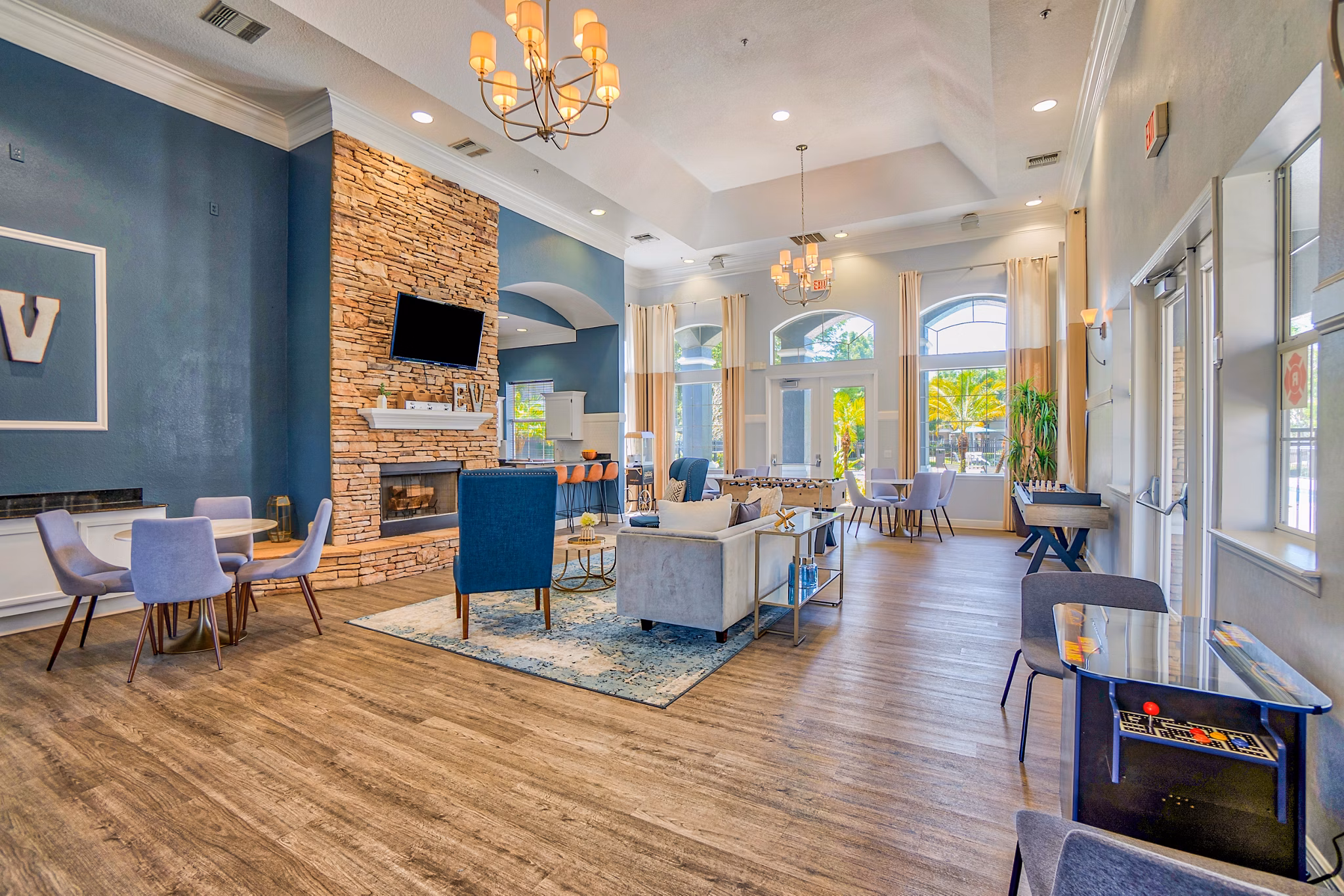 Inviting clubhouse with cozy seating and modern decor at Elmhurst Village Apartments