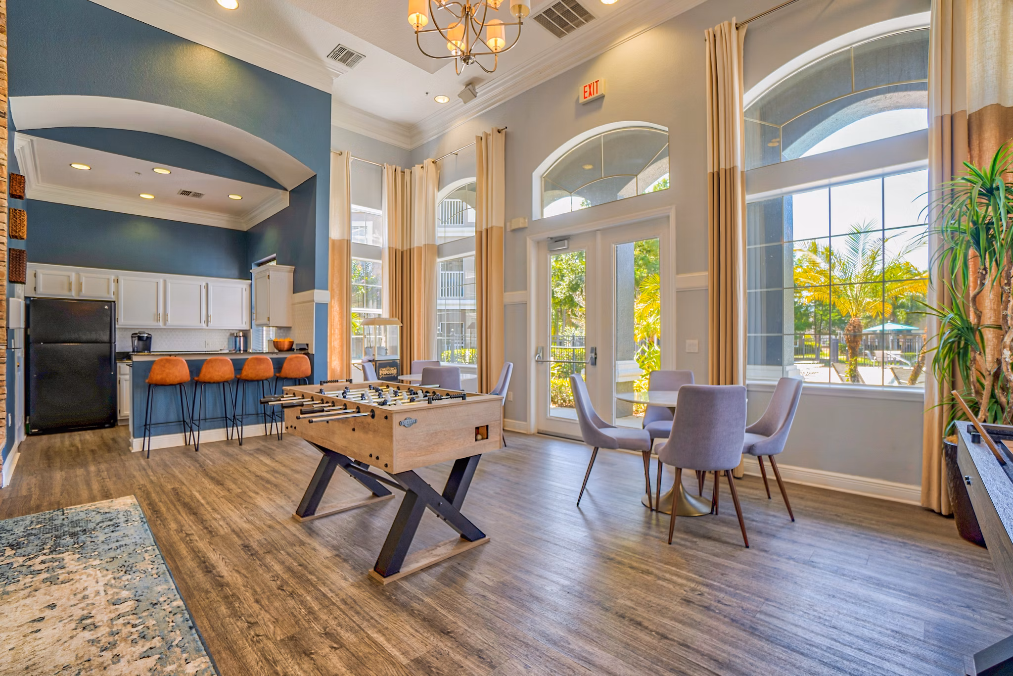 Spacious clubhouse with modern furnishings at Elmhurst Village Apartments