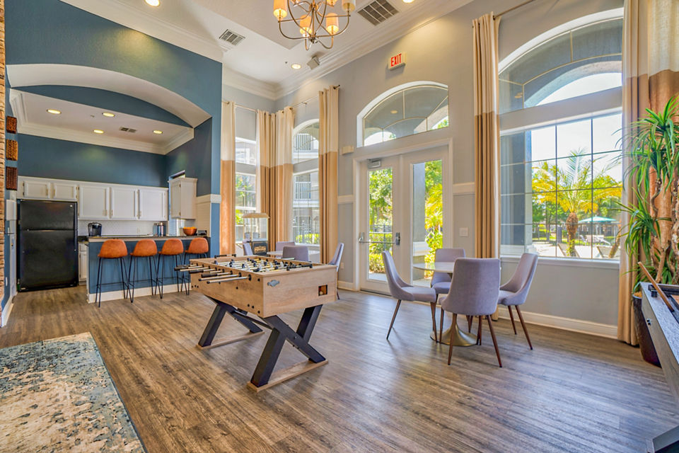 Spacious clubhouse with modern furnishings at Elmhurst Village Apartments