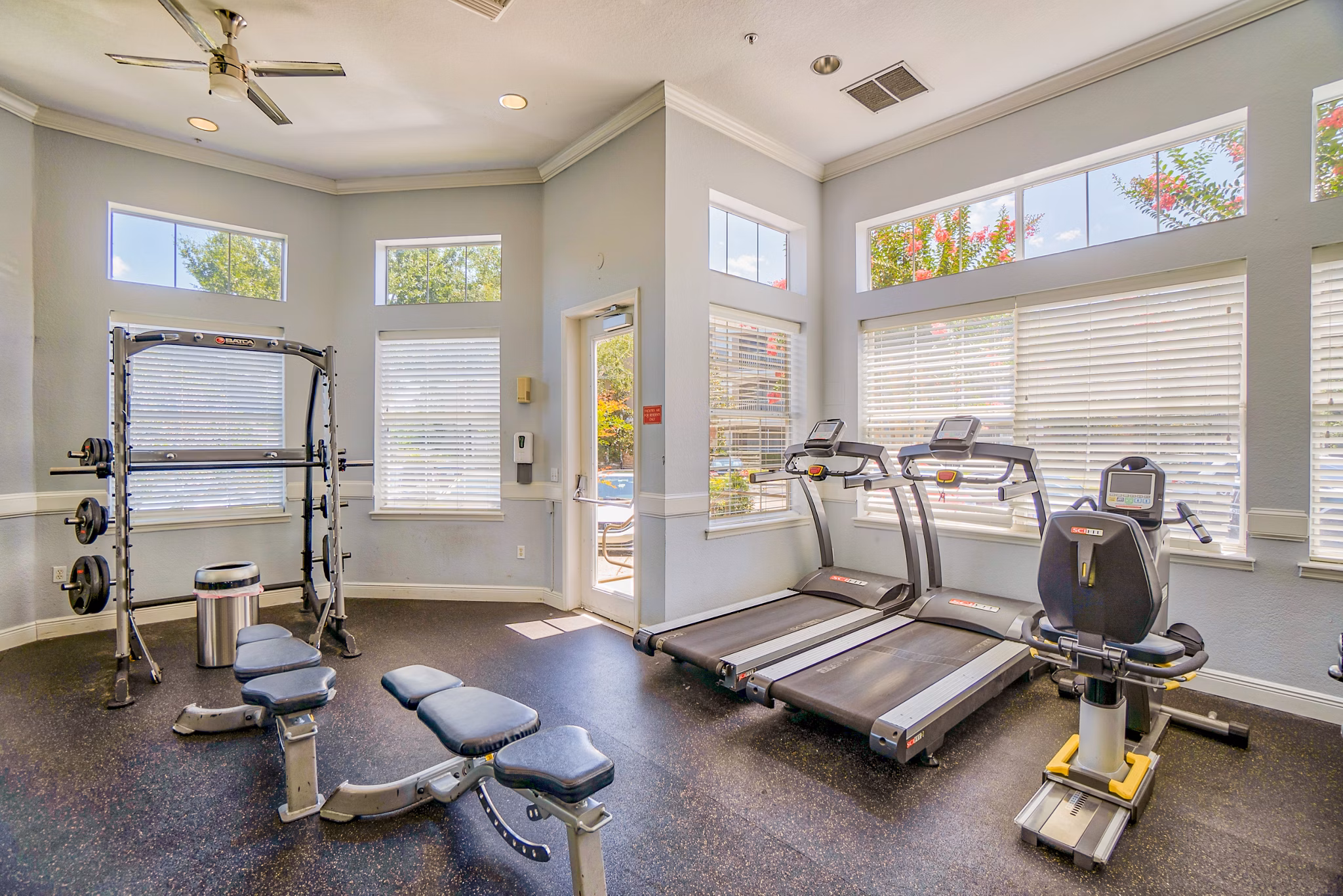 Modern fitness center with state-of-the-art equipment at Elmhurst Village Apartments for luxury living enthusiasts