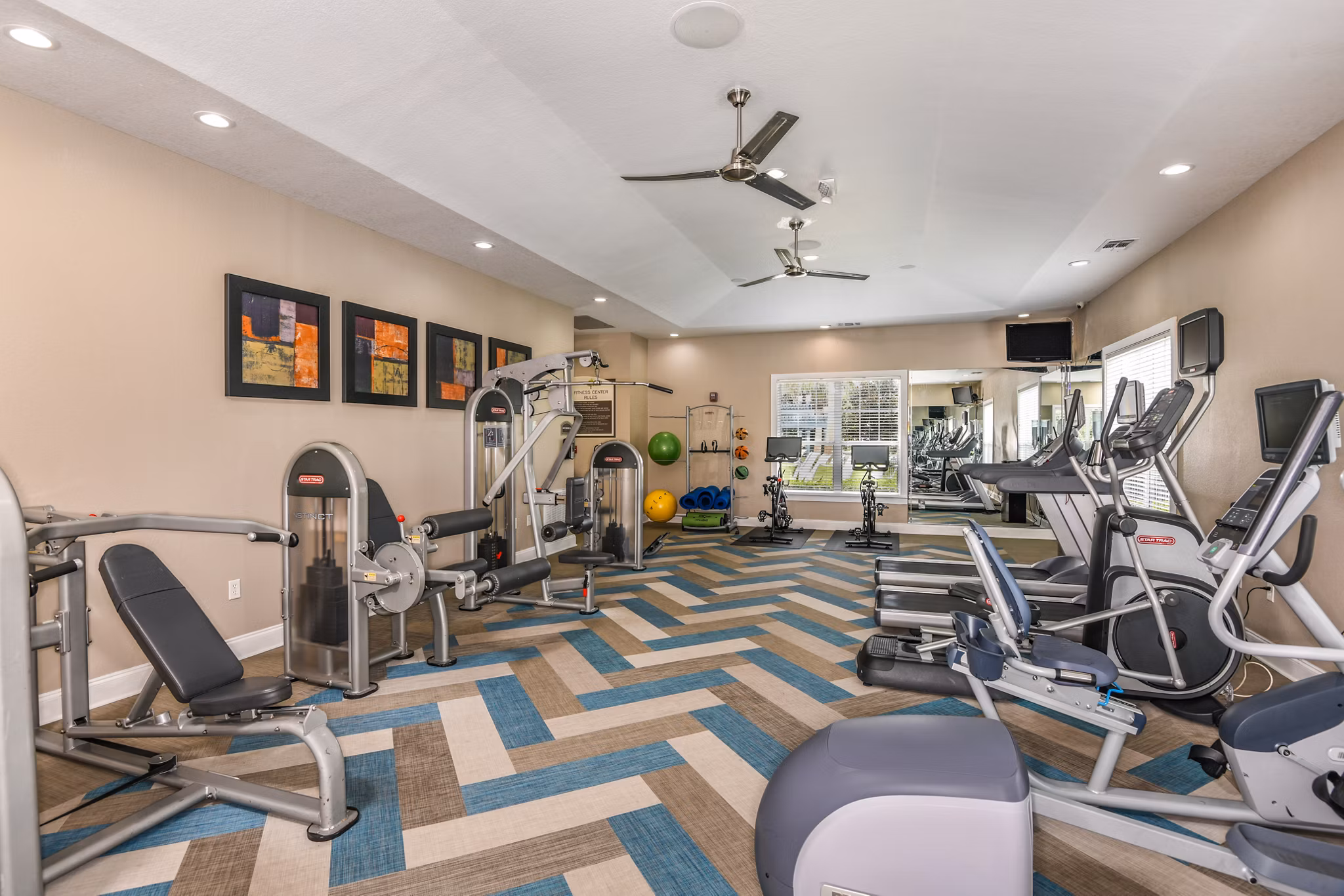 State-of-the-art fitness center with modern equipment at Arbor Glen Apartments