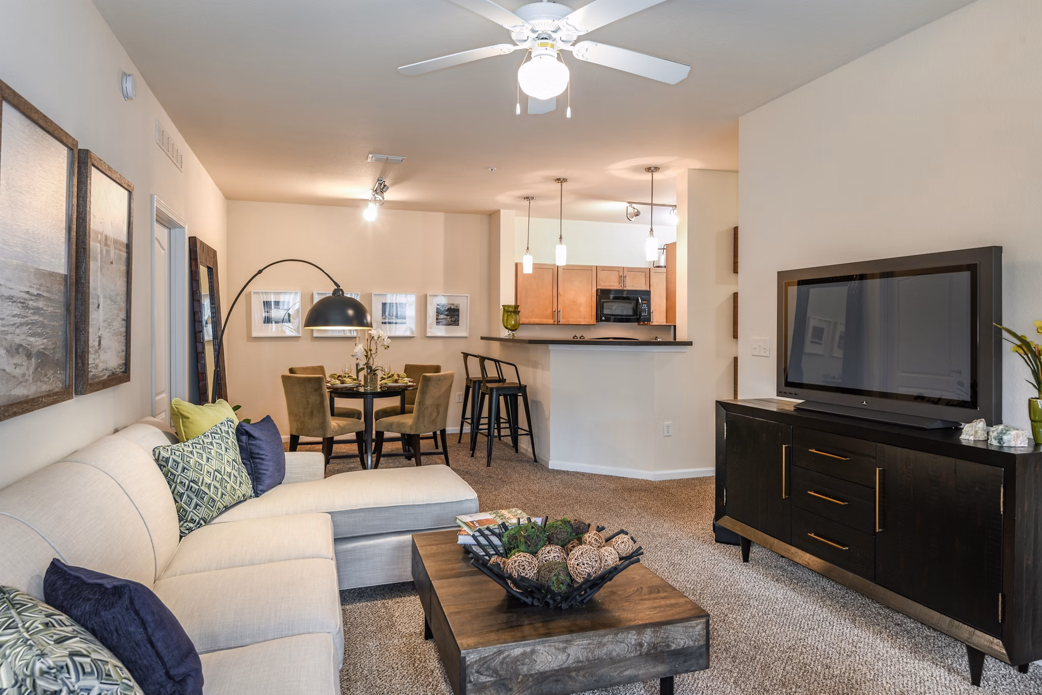Cozy living room with plush seating and a modern coffee table at Arbor Glen Apartments