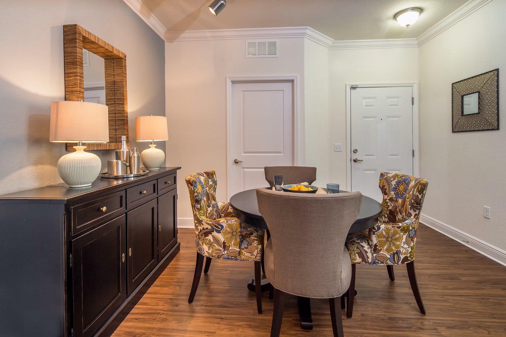 Dining area with sleek furniture and modern lighting in Trinity Club Apartments