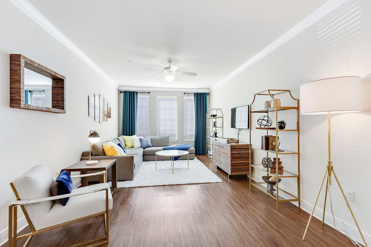 Living room featuring comfortable seating and modern decor at Trinity Club Apartments
