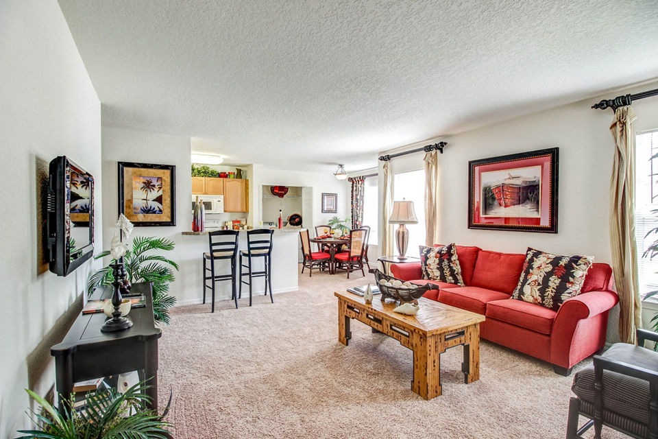 Modern living room with plush seating and stylish decor at Hawthorne Village Apartments