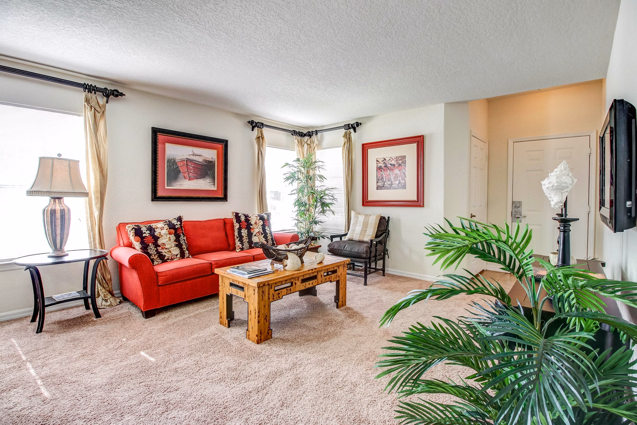 Cozy living room featuring modern decor and natural light at Hawthorne Village Apartments