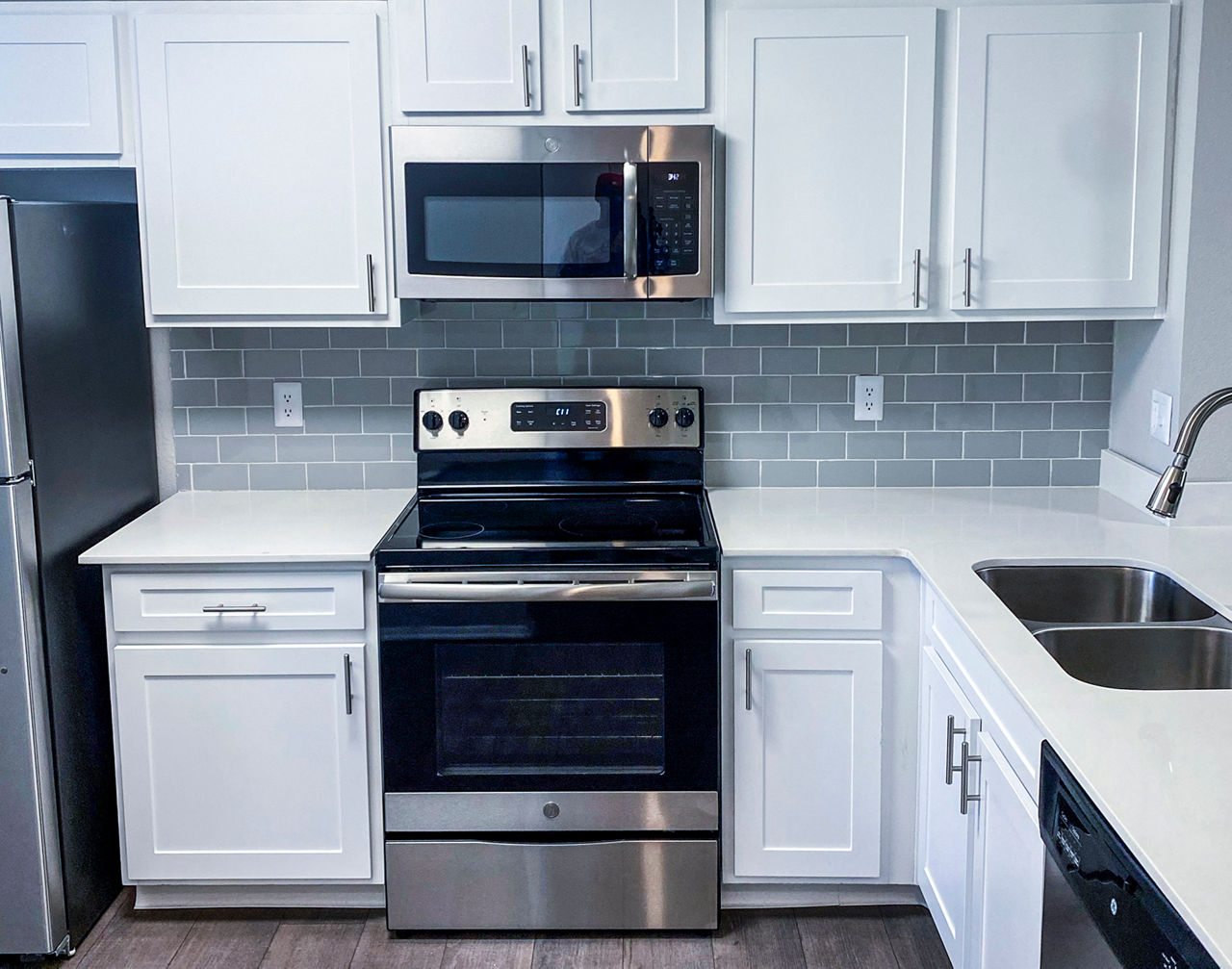 Modern kitchen with stainless steel appliances at The Crest at Altamonte Apartments