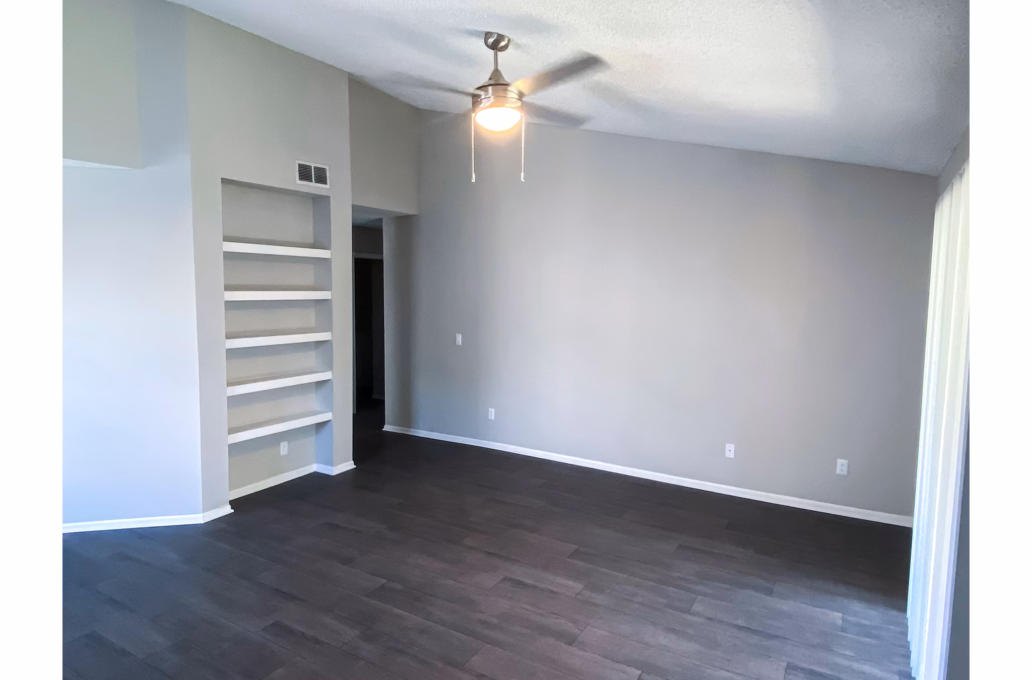Modern living room with cozy seating and natural light at The Crest at Altamonte Apartments