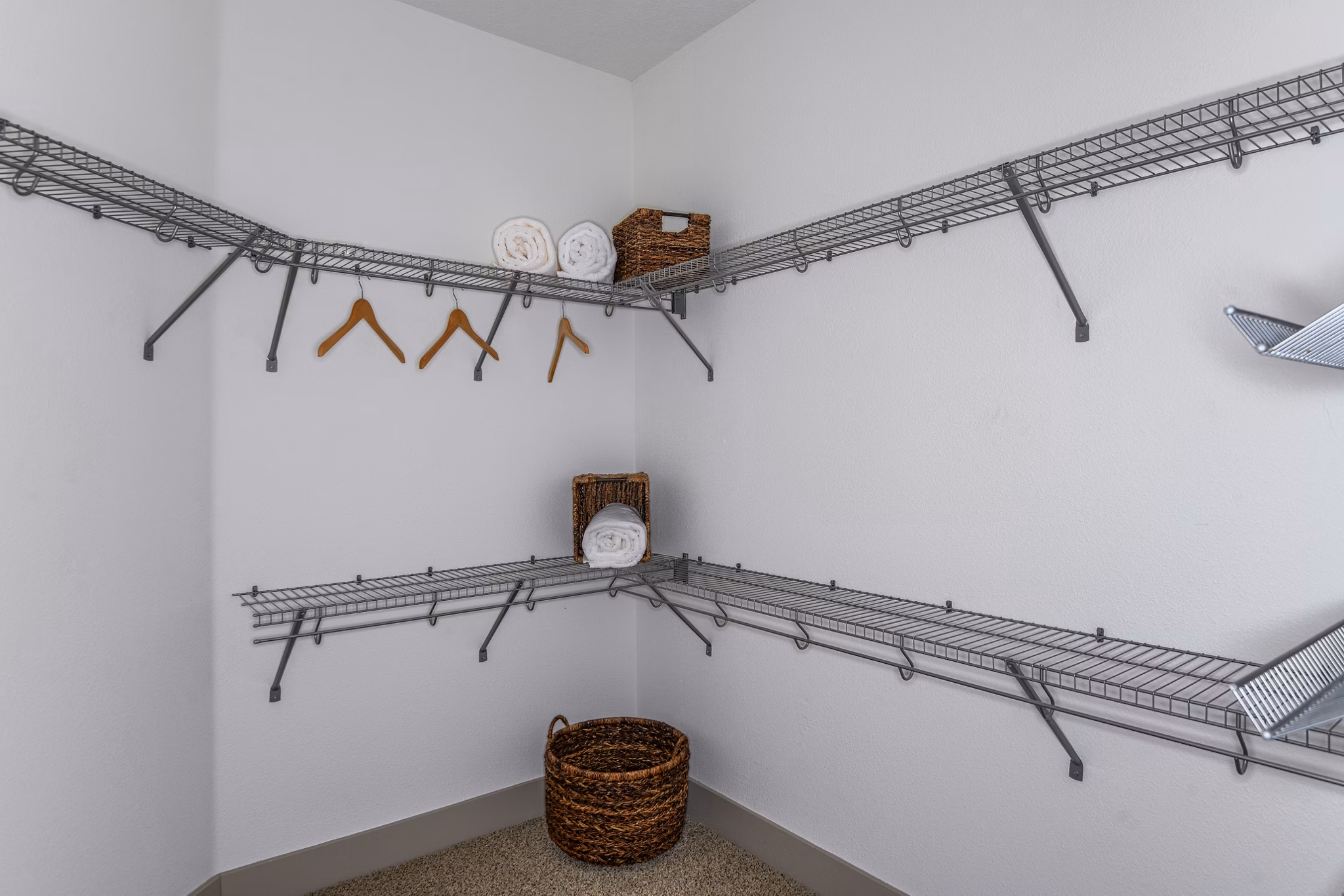 Walk-in closet featuring ample storage in The Gallery at Mills Park Apartments