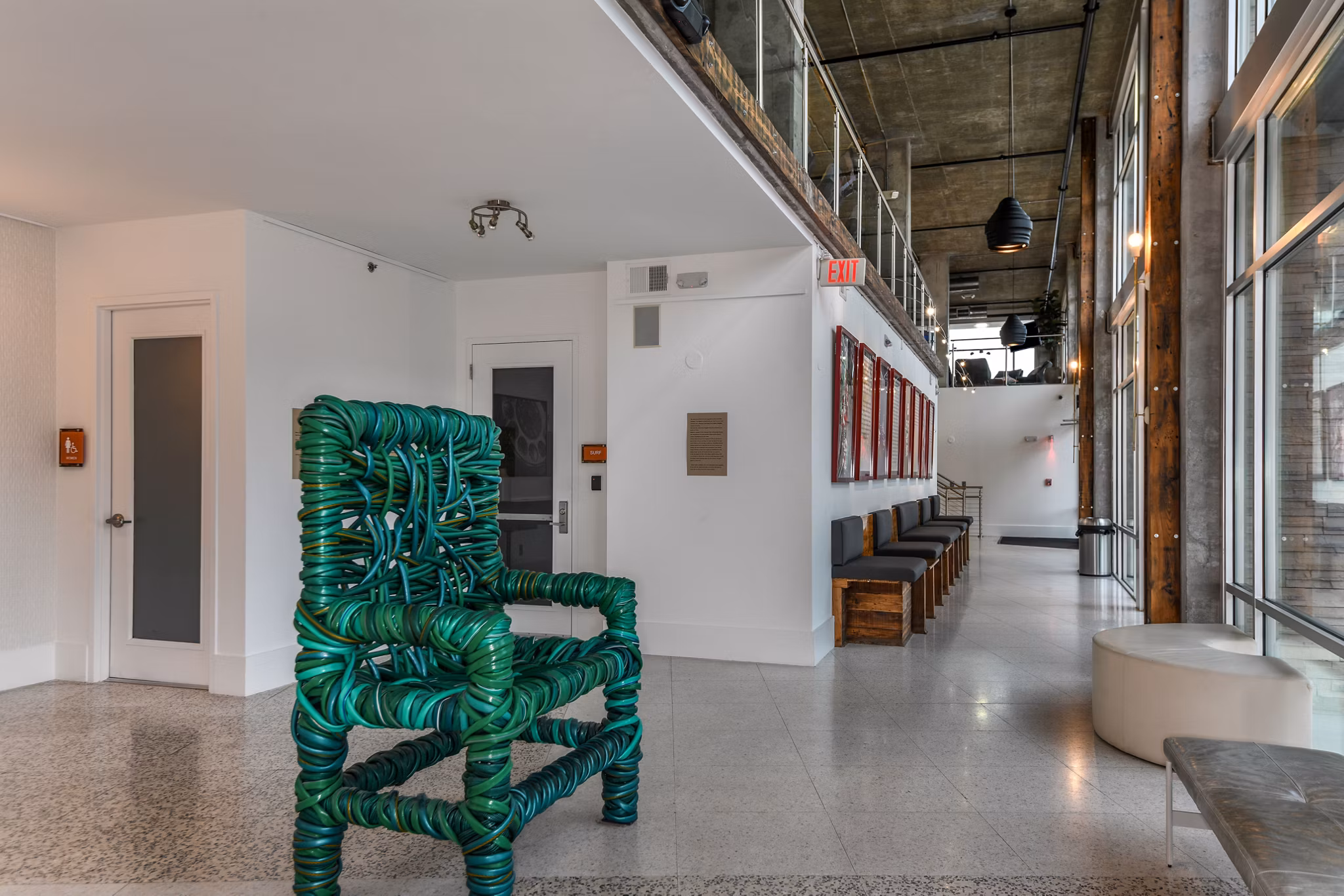 Clubhouse featuring modern seating and decor at The Gallery at Mills Park Apartments