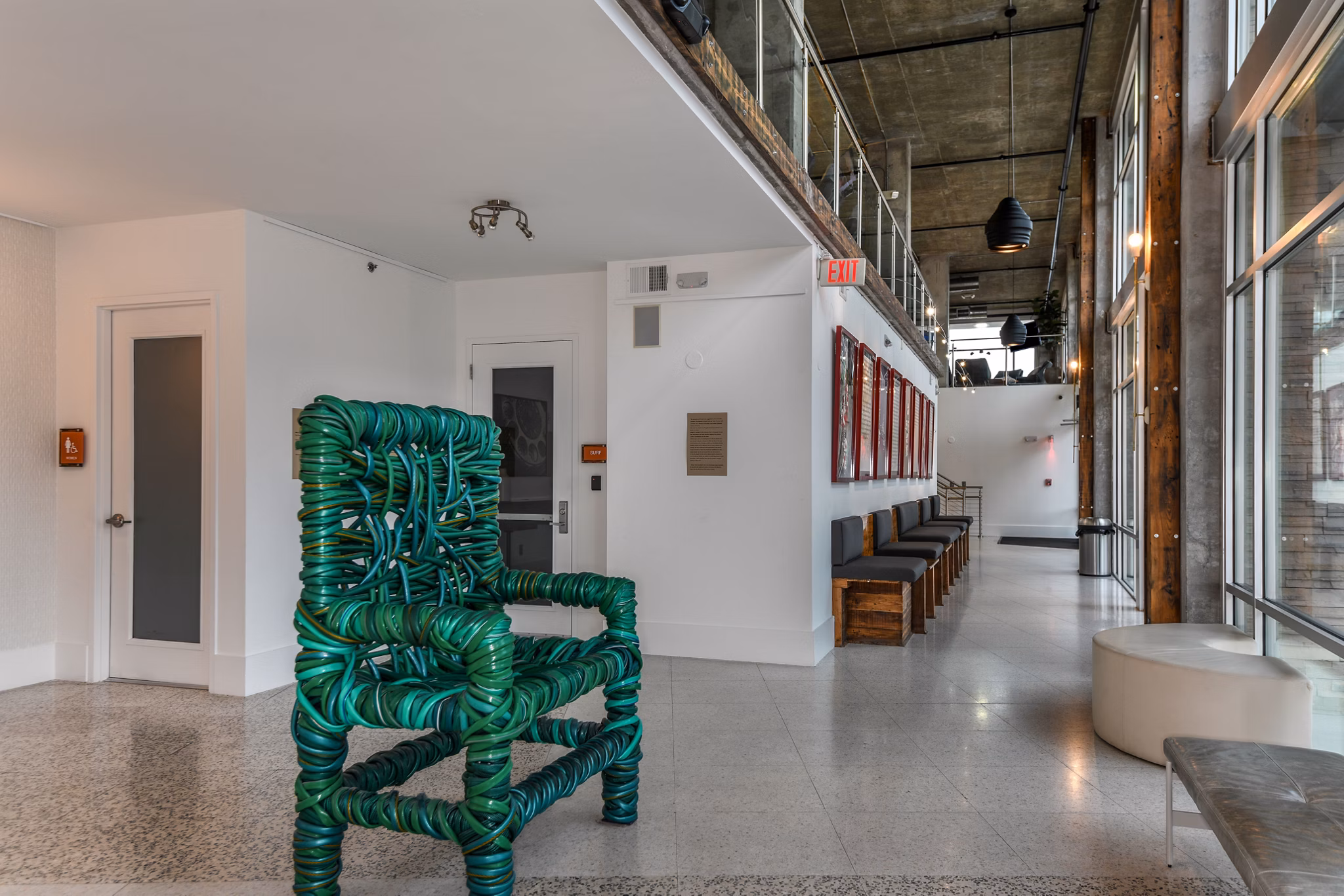 Clubhouse featuring modern seating and decor at The Gallery at Mills Park Apartments