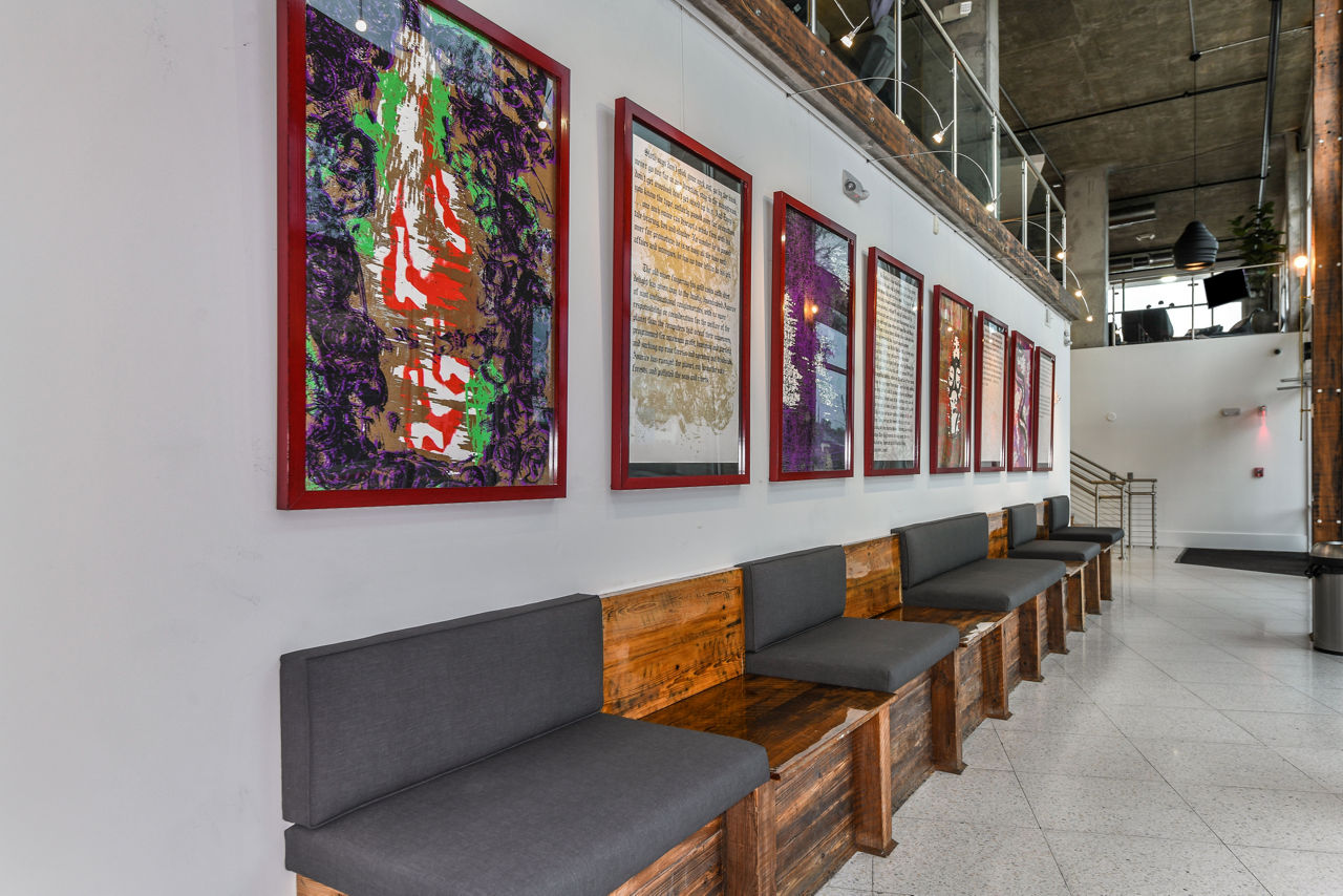 Modern clubhouse with stylish seating and vibrant decor at The Gallery at Mills Park Apartments