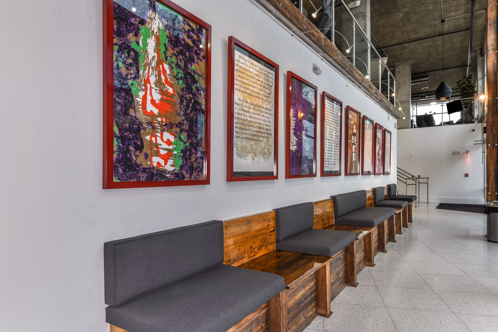 Modern clubhouse with stylish seating and vibrant decor at The Gallery at Mills Park Apartments