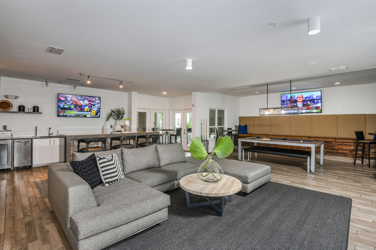 Clubhouse with modern furnishings at The Gallery at Mills Park Apartments