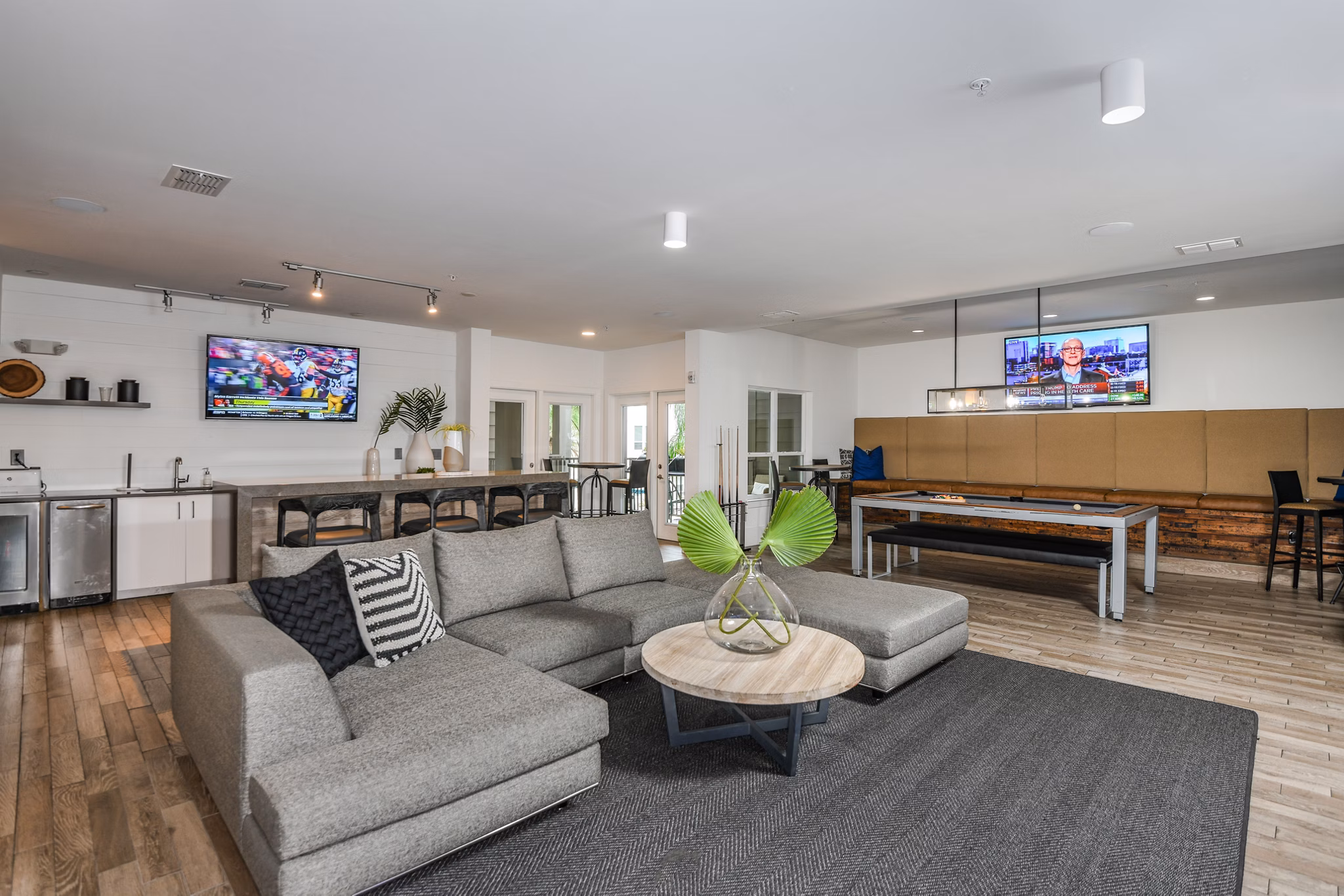 Clubhouse with modern furnishings at The Gallery at Mills Park Apartments