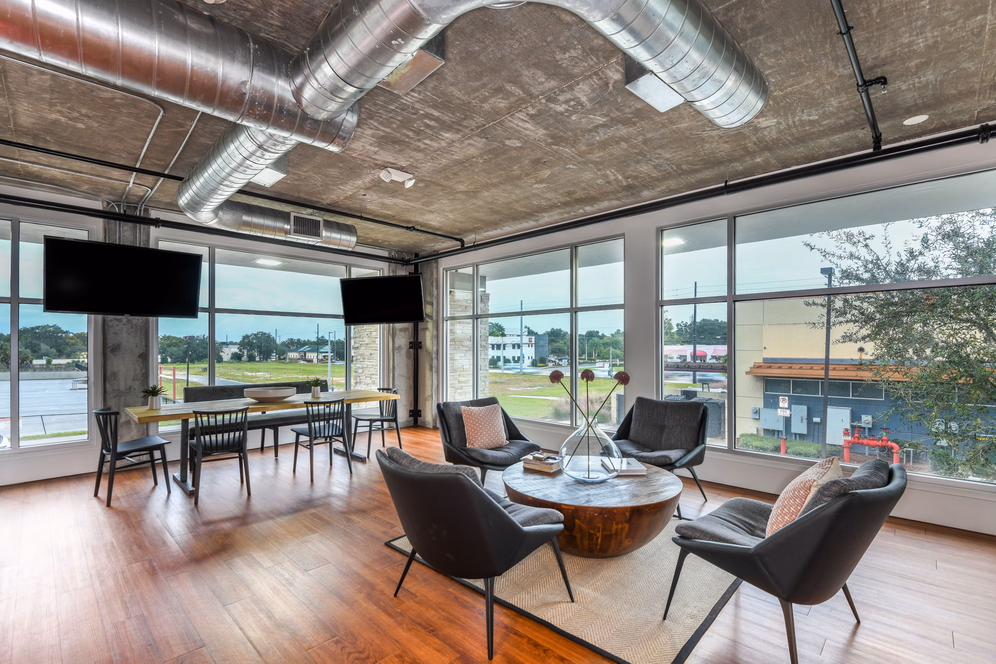 Clubhouse featuring modern design and social spaces at The Gallery at Mills Park Apartments