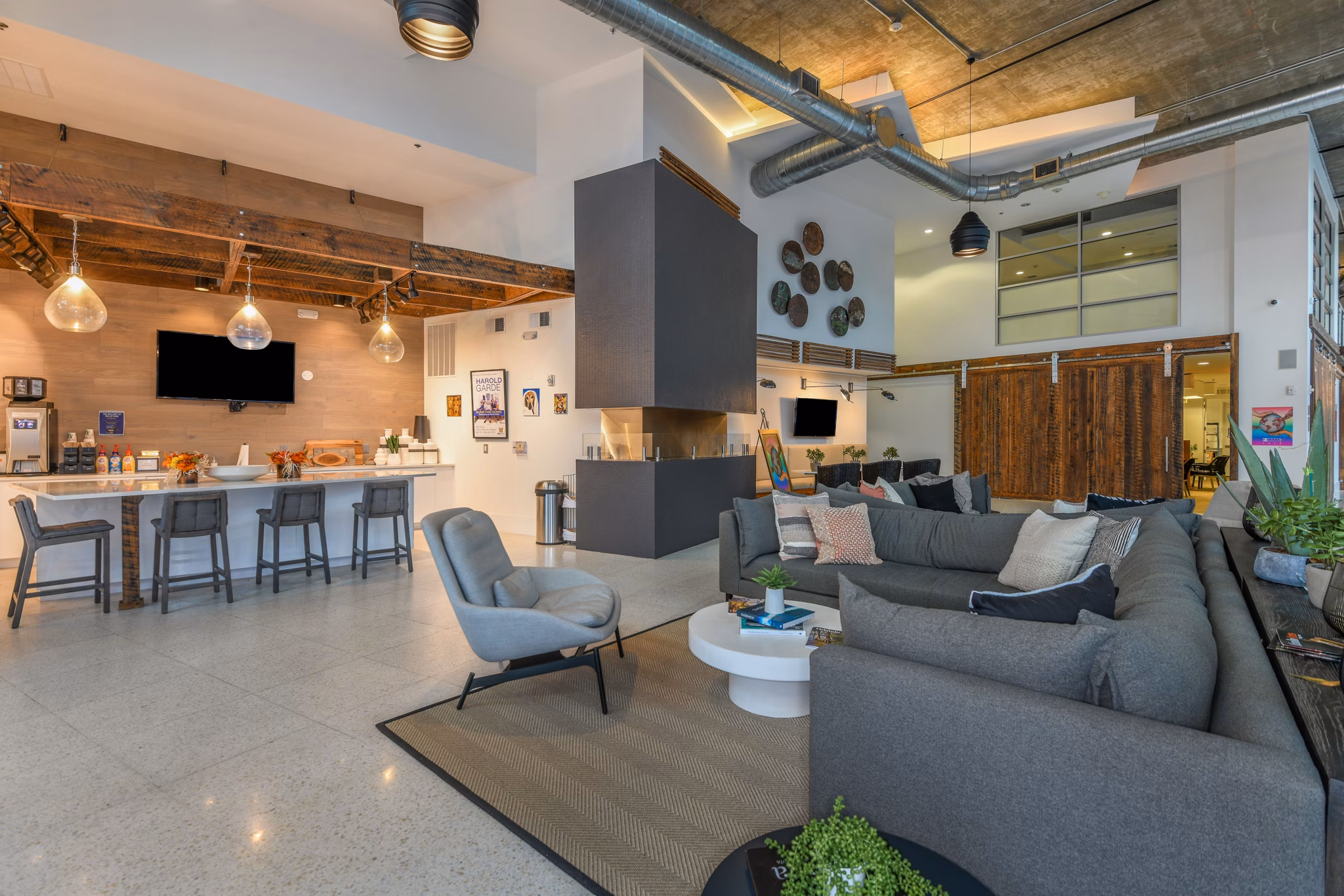 Clubhouse featuring elegant interiors and modern design at The Gallery at Mills Park Apartments