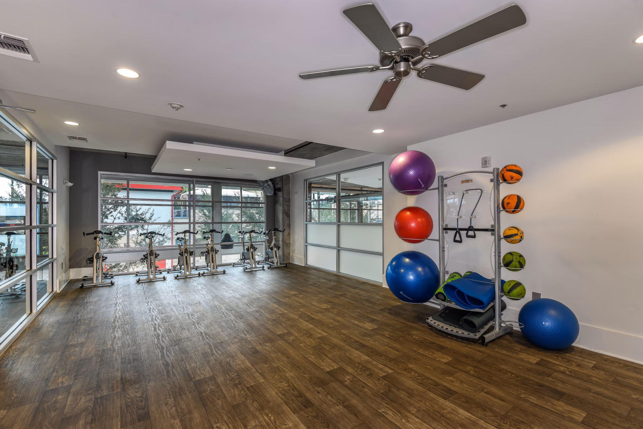 State-of-the-art fitness center at The Gallery at Mills Park Apartments featuring modern equipment and spacious workout areas