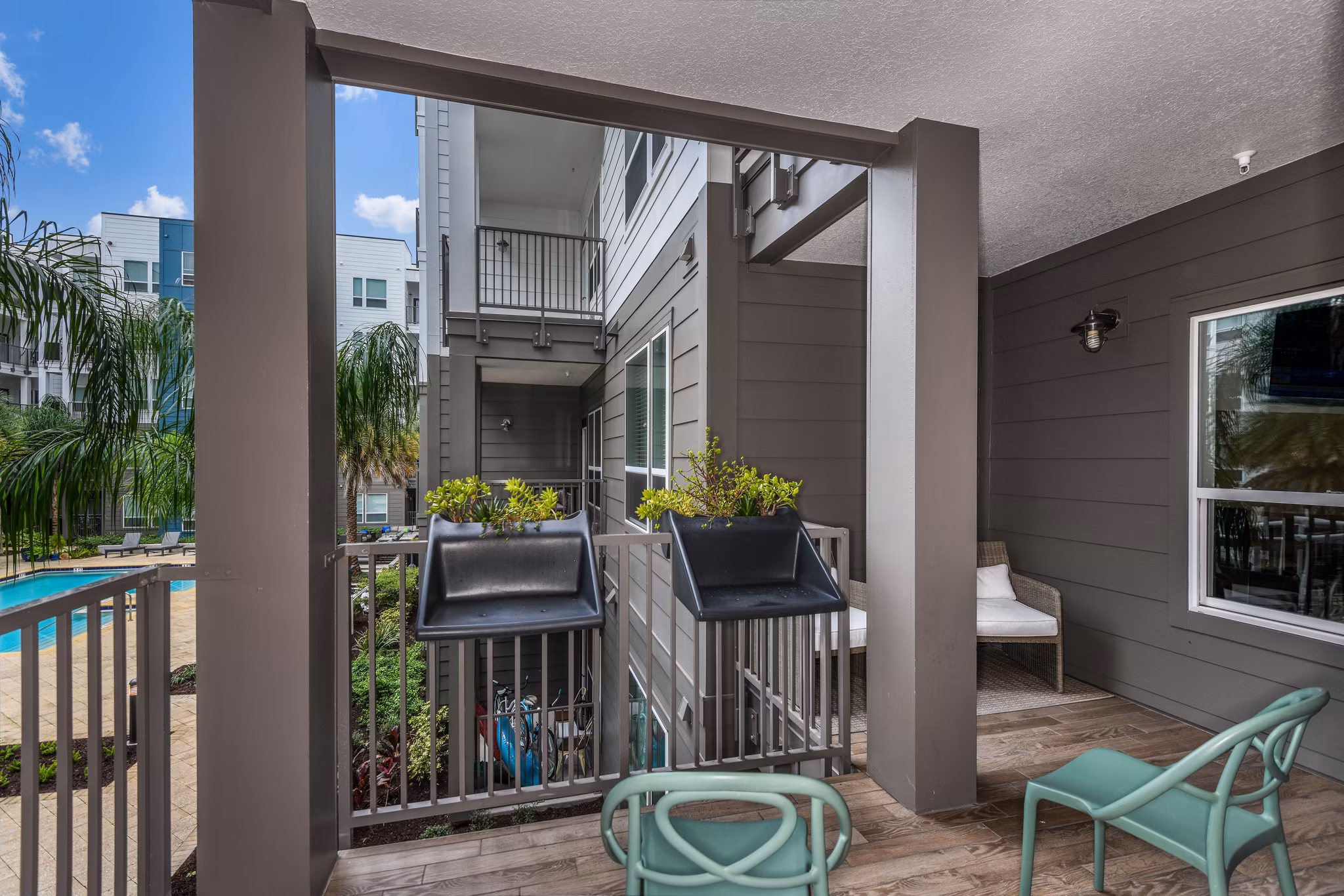 Charming patio with comfortable seating at The Gallery at Mills Park Apartments, perfect for relaxation and social gatherings