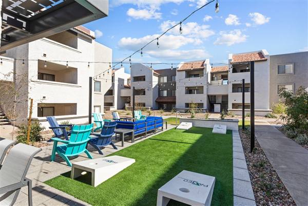 grill area/sport court/patio at Paseo on University Apartments