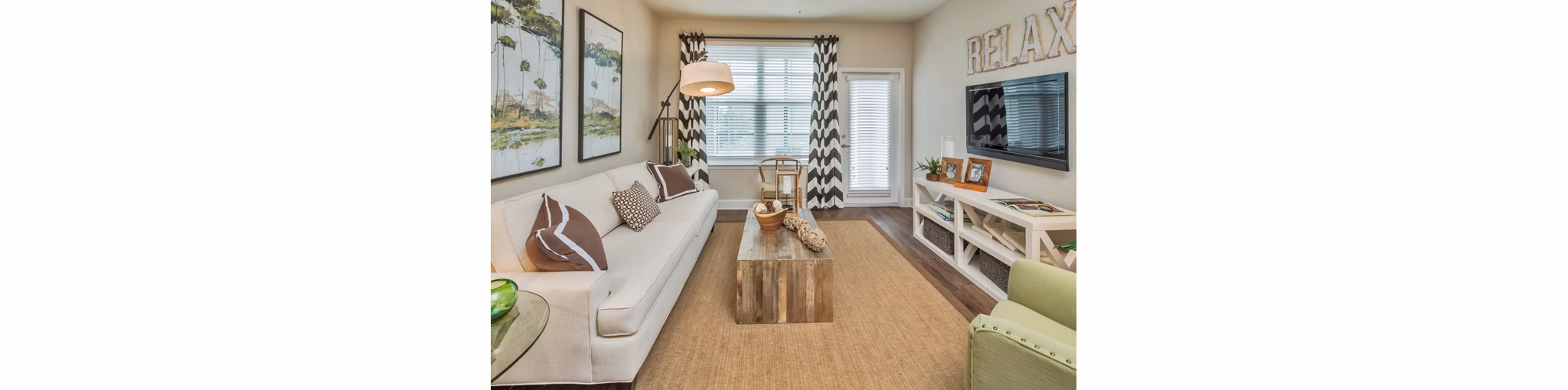 Cozy living room with contemporary decor at Trinity Exchange Luxury Apartments, offering comfort and style for residents
