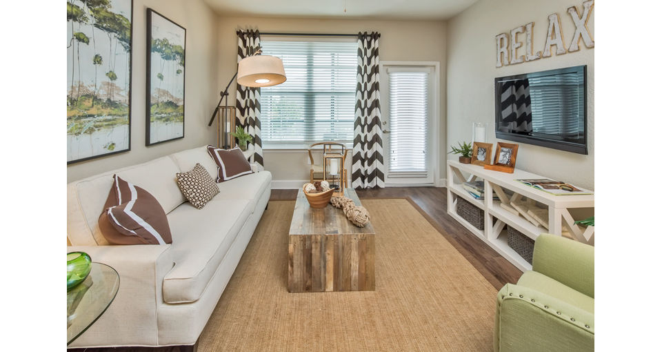 Cozy living room with contemporary decor at Trinity Exchange Luxury Apartments, offering comfort and style for residents