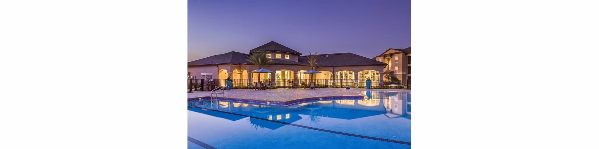 Luxurious pool with cabanas at Trinity Exchange Luxury Apartments, featuring modern design