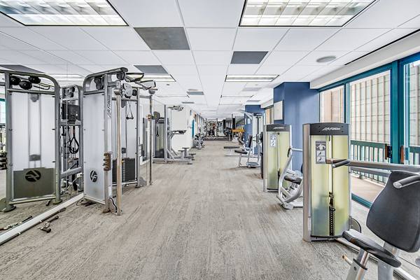 fitness center at One Superior Place Apartments