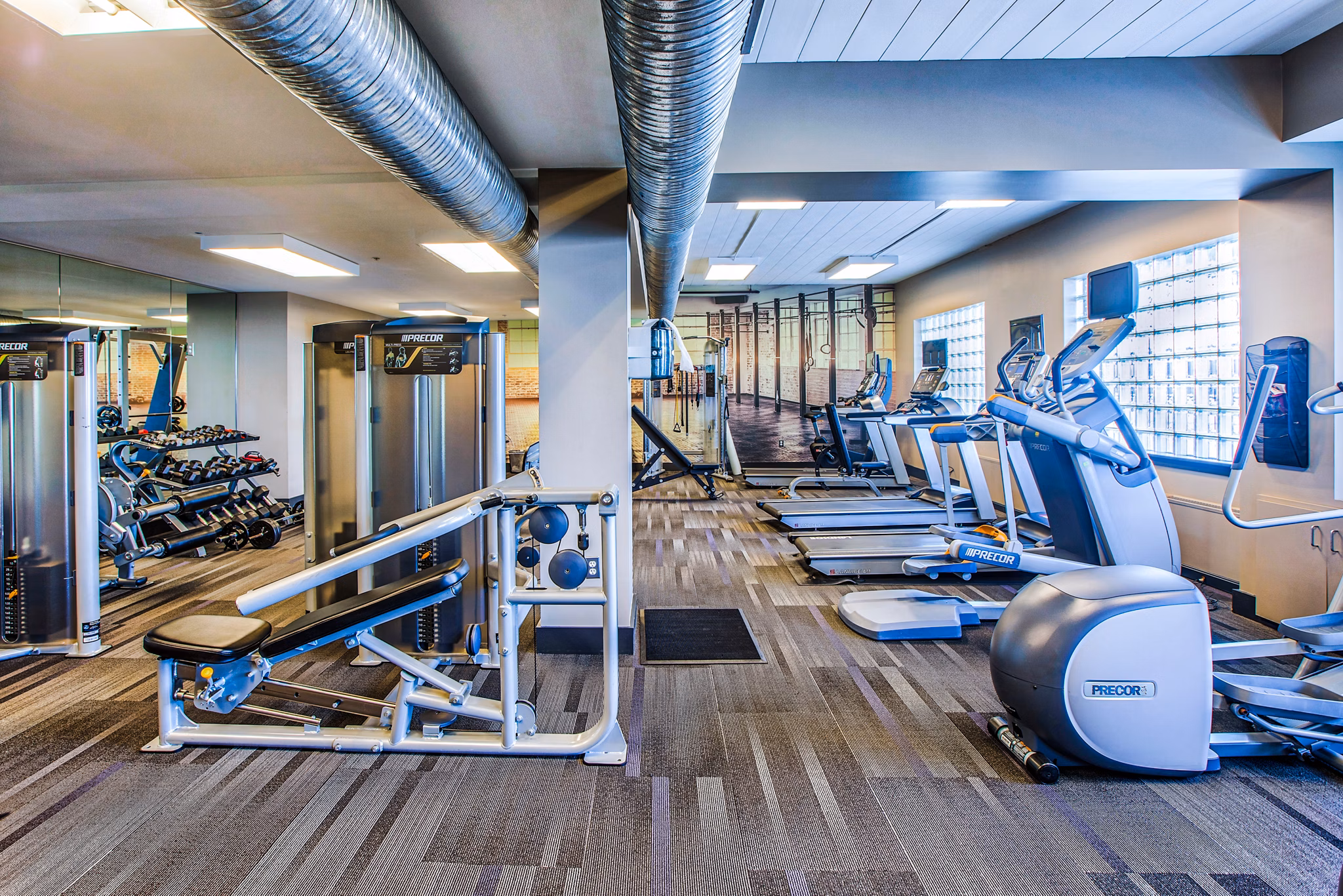Modern fitness center with state-of-the-art equipment at McHenry Row Apartments