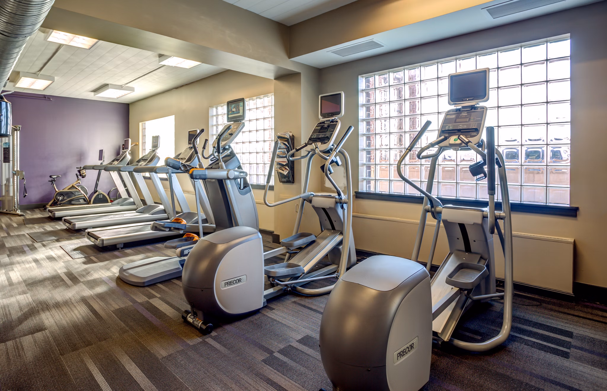 State-of-the-art fitness center at McHenry Row Apartments with modern equipment for an energizing workout