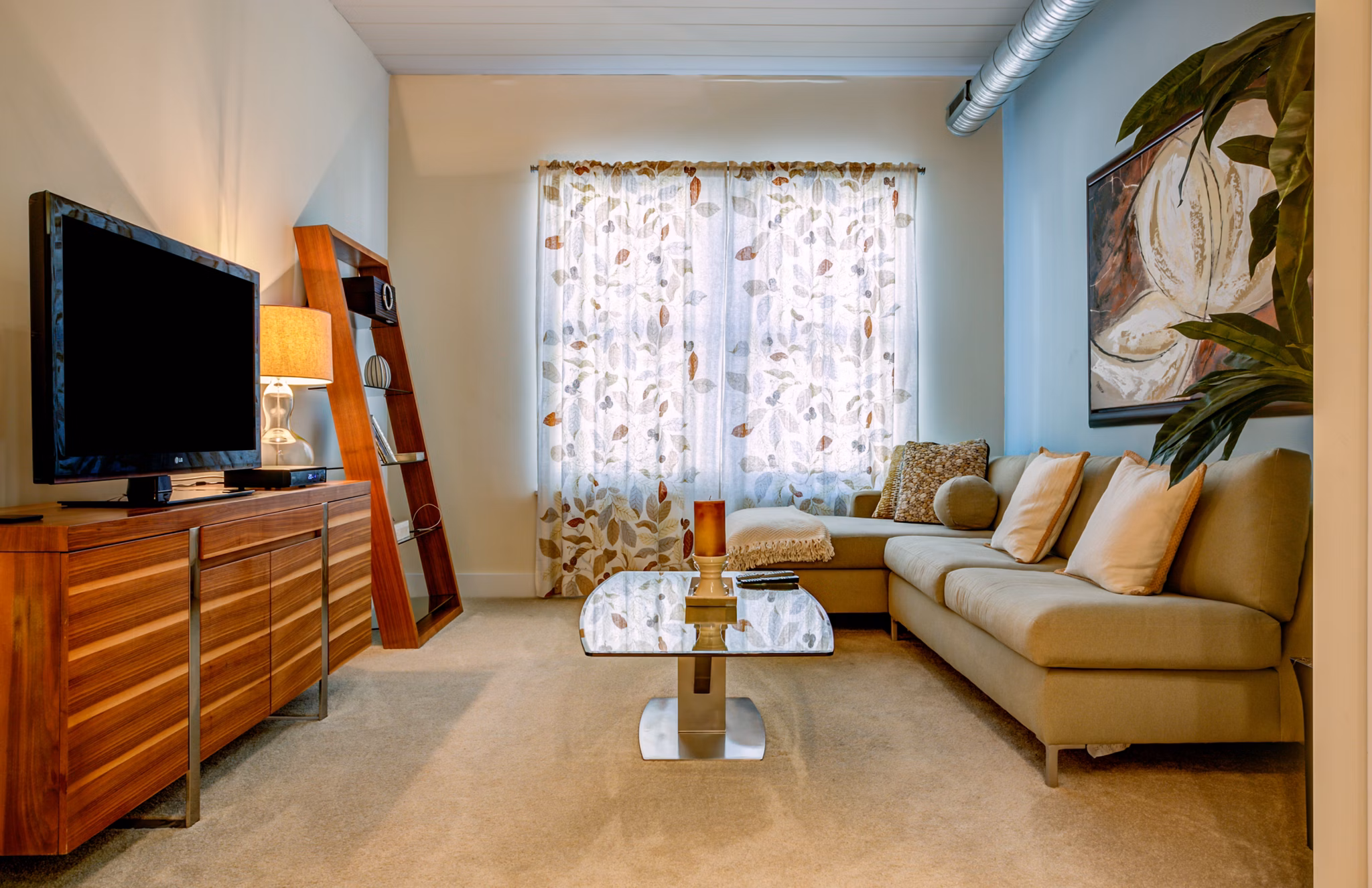 Spacious living room with modern decor at McHenry Row Apartments