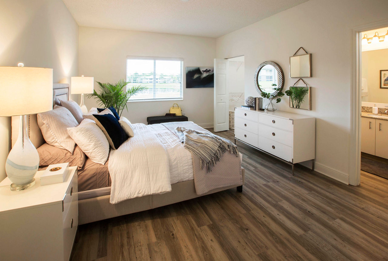 Cozy bedroom with natural light at Citation Club Apartments