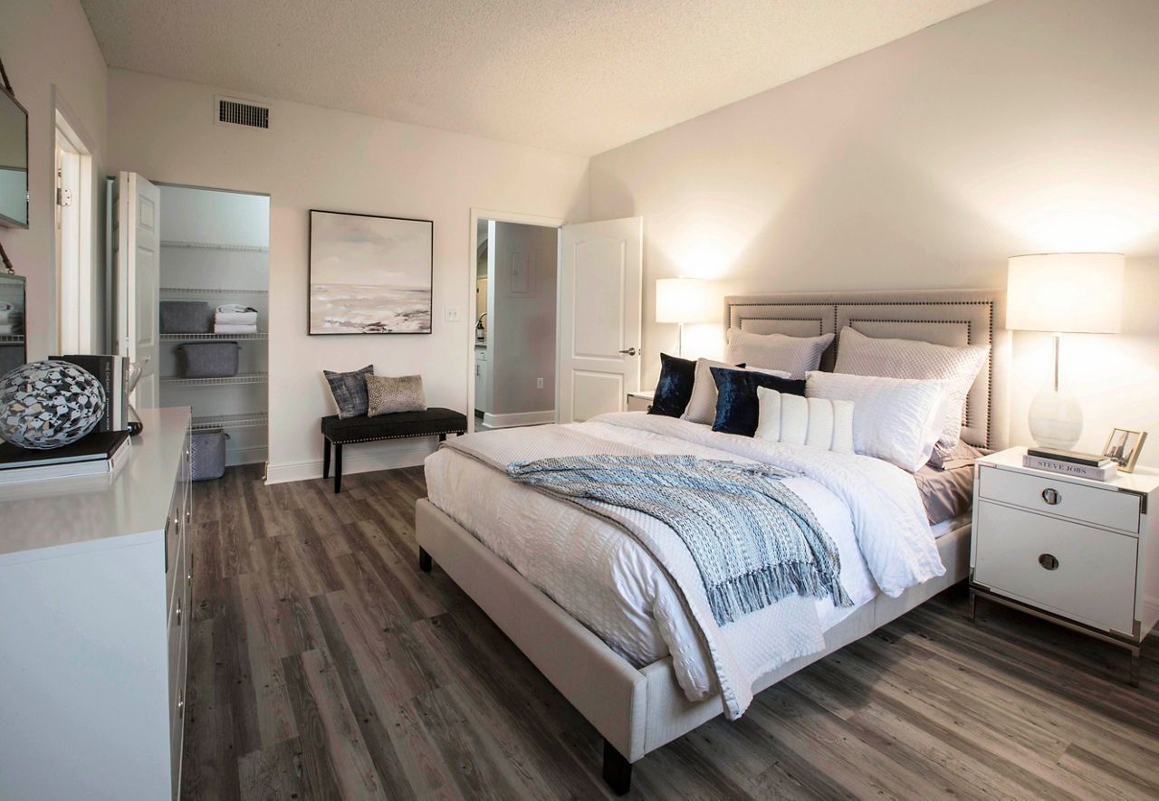 Cozy bedroom with modern decor and natural lighting at Citation Club Apartments