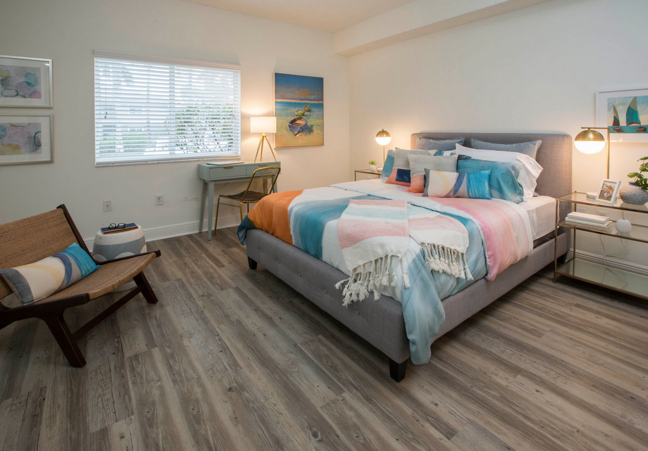 Cozy bedroom with modern decor at Citation Club Apartments, featuring queen-size bed and stylish accents