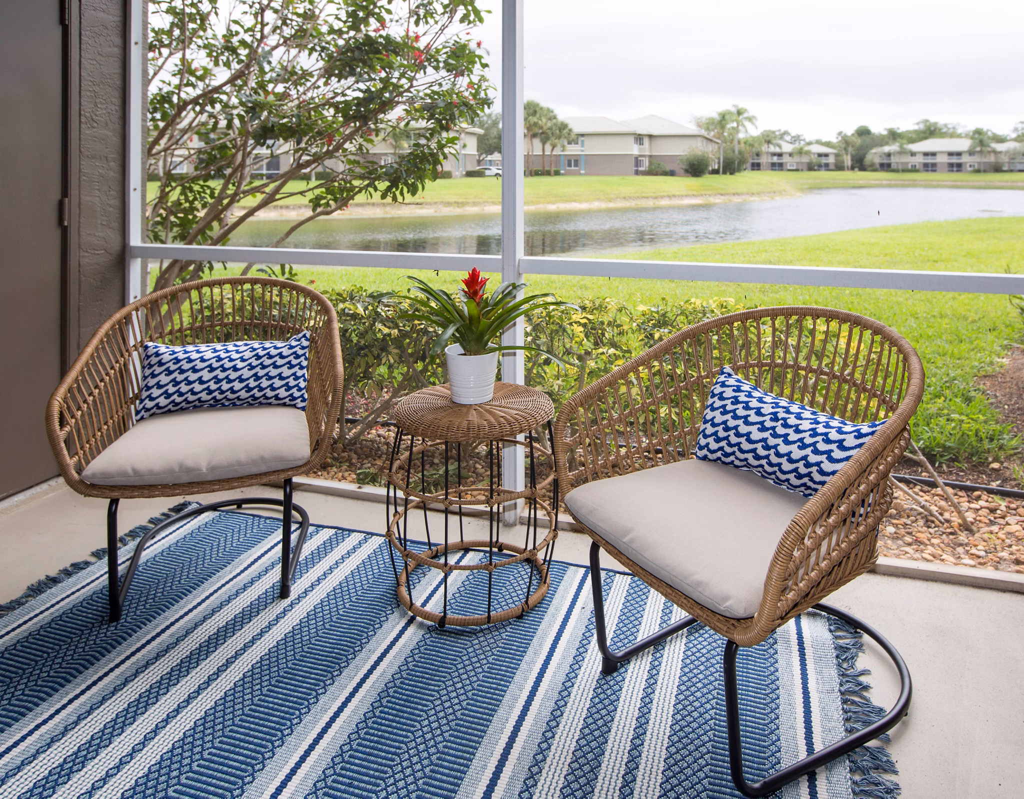 Modern living room with plush seating and large windows in Citation Club Apartments