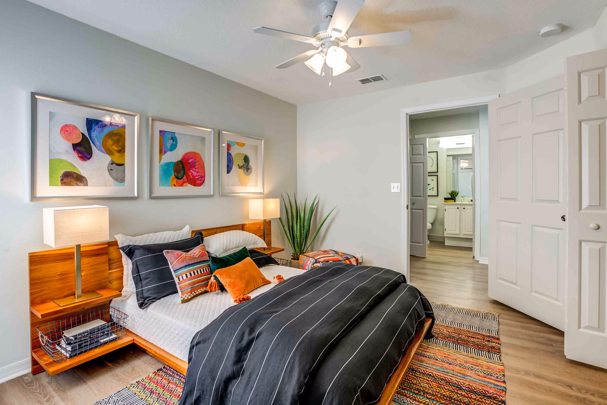 Spacious bedroom with modern decor at Parks at Hunter's Creek Apartments, featuring elegant furnishings and ample natural light