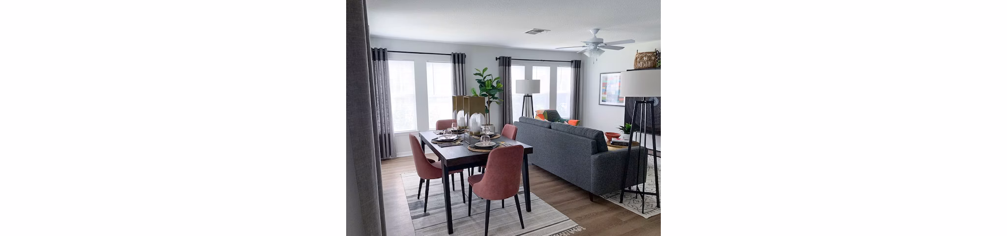 Dining room featuring elegant lighting and modern furniture at Parks at Hunter's Creek Apartments