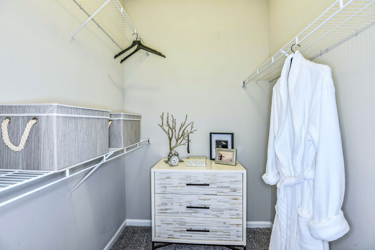 Bedroom closet with custom shelving and ample storage space at 54 Magnolia Apartments, a Greystar luxury community
