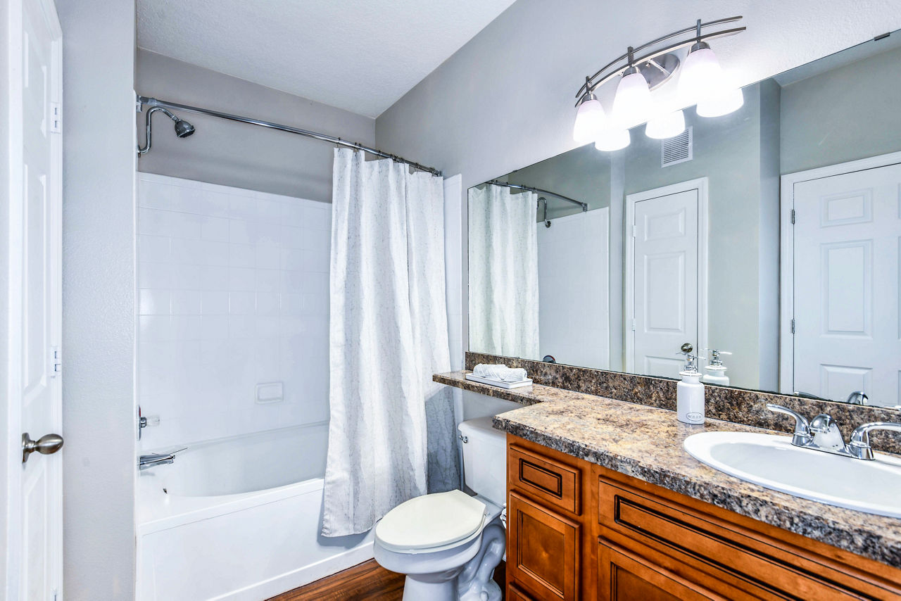 Bathroom featuring modern fixtures in 54 Magnolia Apartments with luxury design