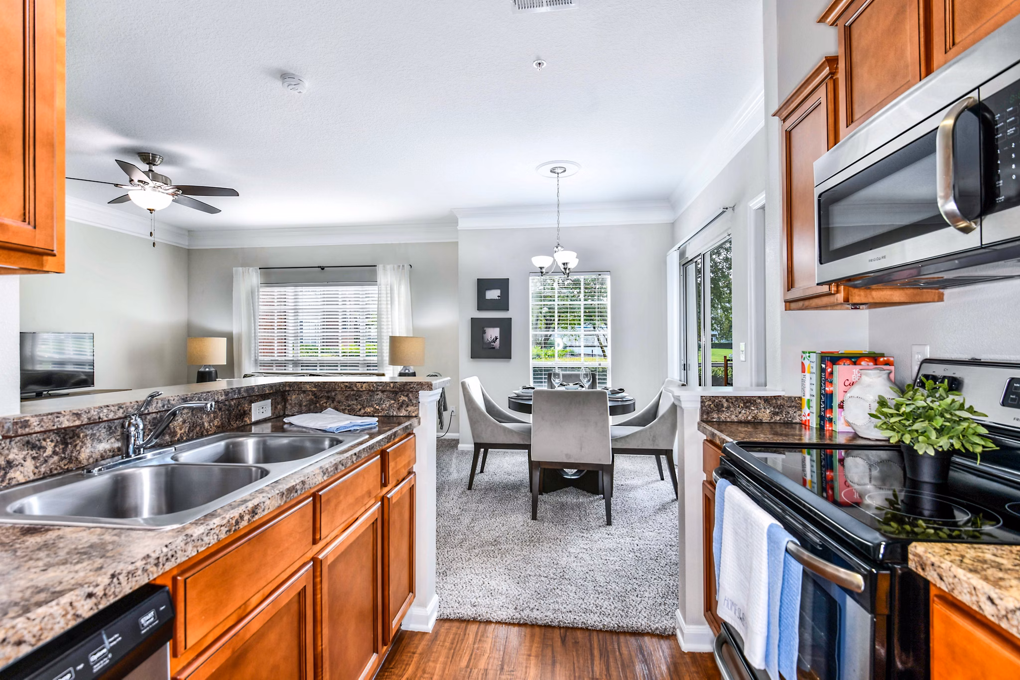 Dining room featuring elegant furnishings at 54 Magnolia Apartments, luxury living by Greystar
