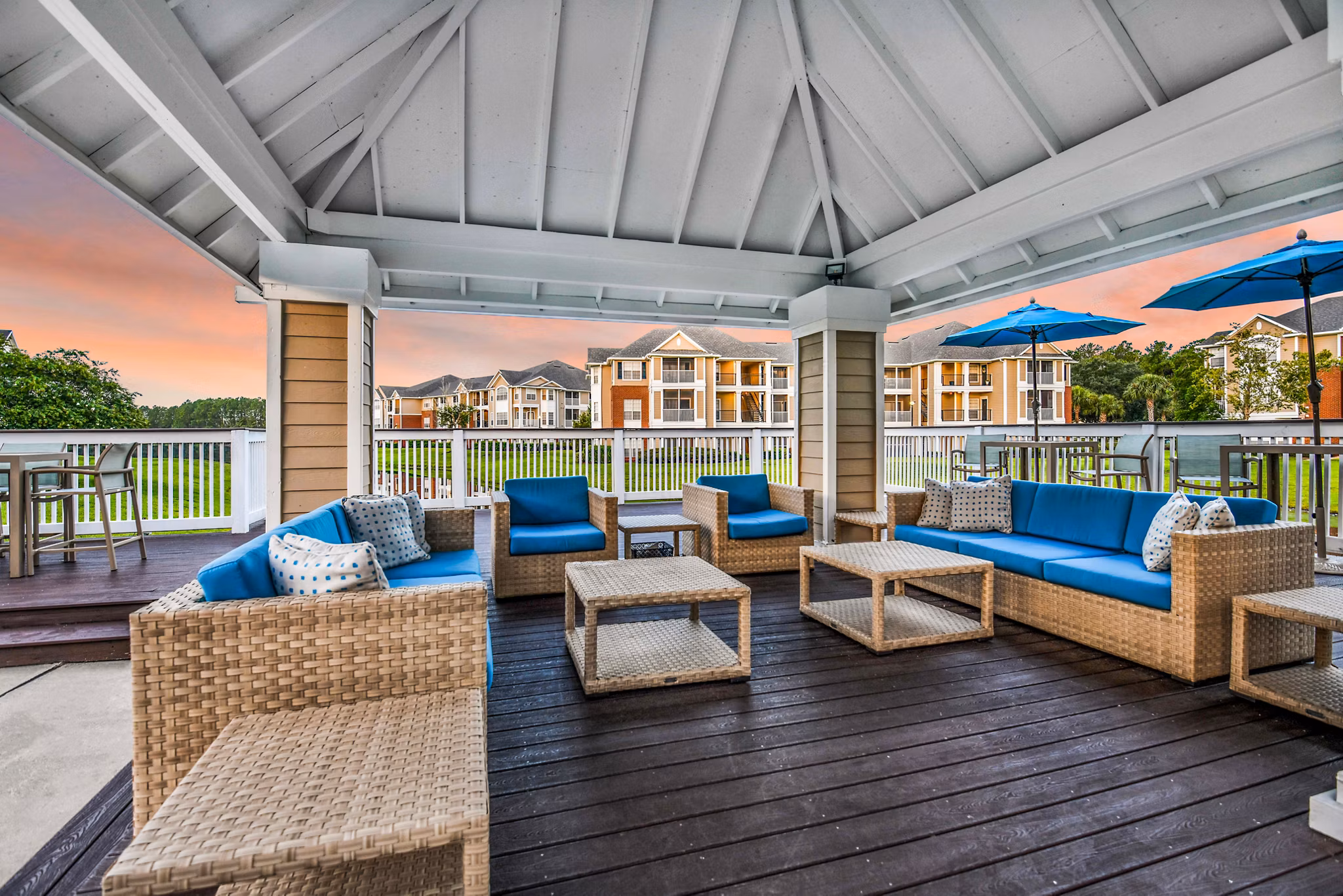 Charming outdoor patio with seating and greenery at 54 Magnolia Apartments, a luxury Greystar property