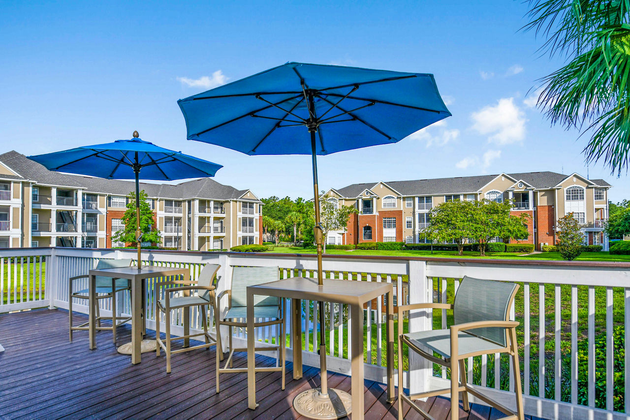 Outdoor patio with seating area at 54 Magnolia Apartments, a luxury community by Greystar