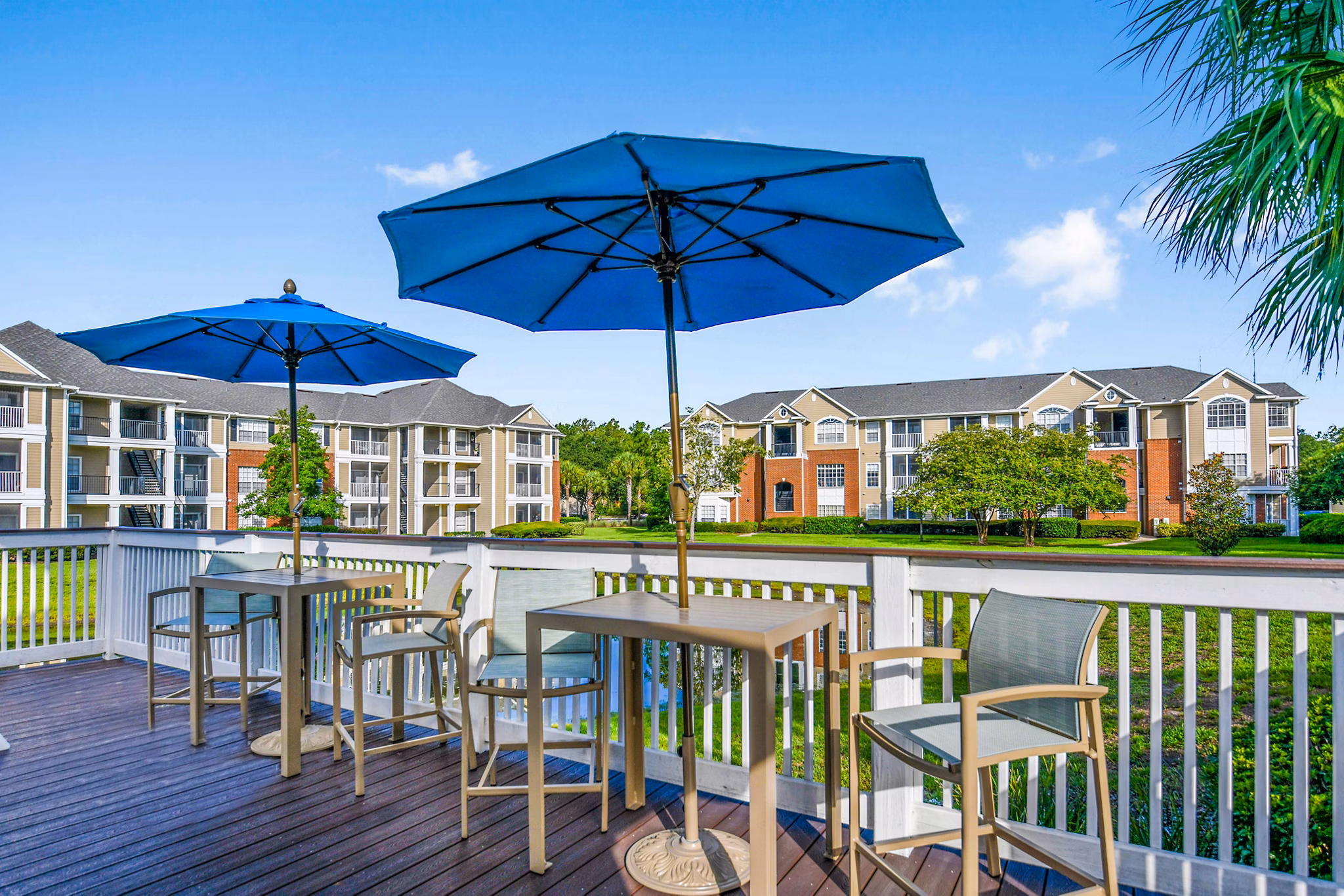 Outdoor patio with seating area at 54 Magnolia Apartments, a luxury community by Greystar