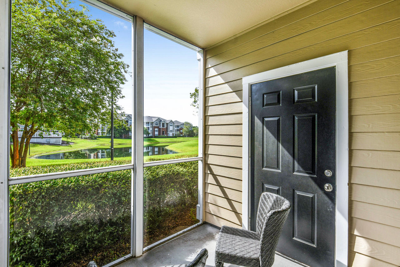 Spacious patio with lounge seating at 54 Magnolia Apartments, perfect for relaxing in style