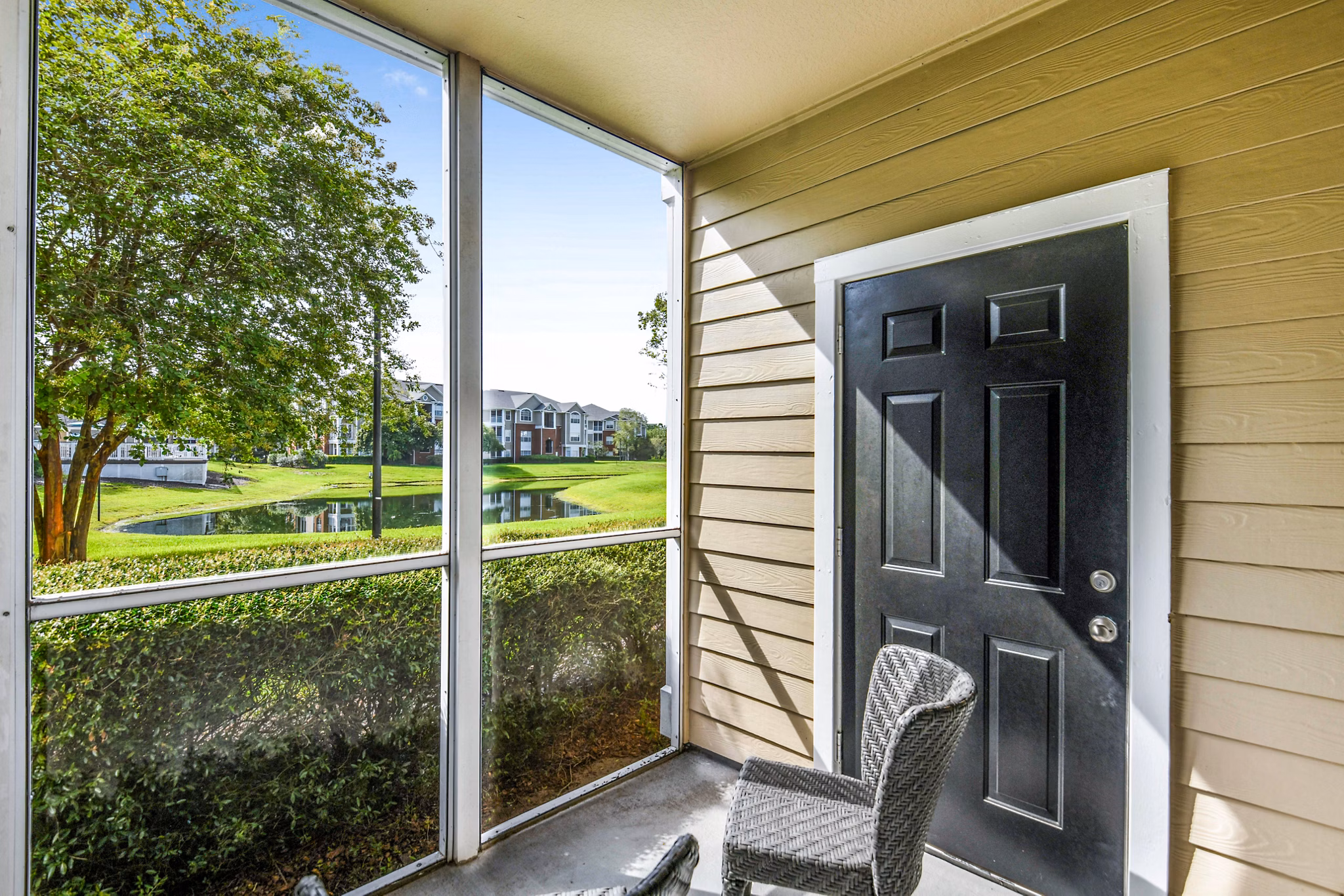 Spacious patio with lounge seating at 54 Magnolia Apartments, perfect for relaxing in style